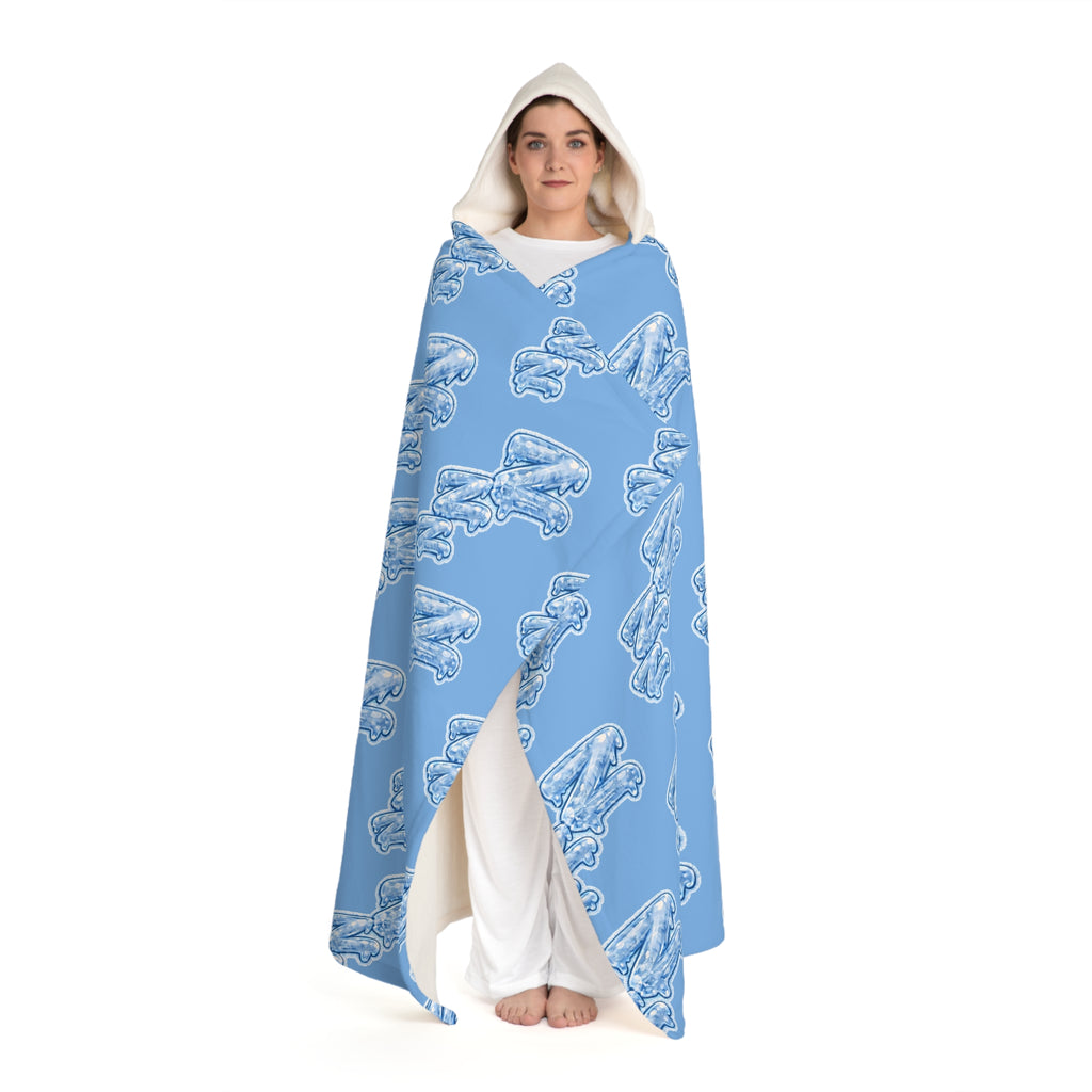 Full-length view of a person wearing the Cozy Blue Hooded Sherpa Blanket with Frozen ZZZ's pattern against a white background.