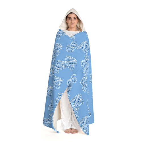 Full-length view of a person wearing the Cozy Blue Hooded Sherpa Blanket with Frozen ZZZ's pattern against a white background.