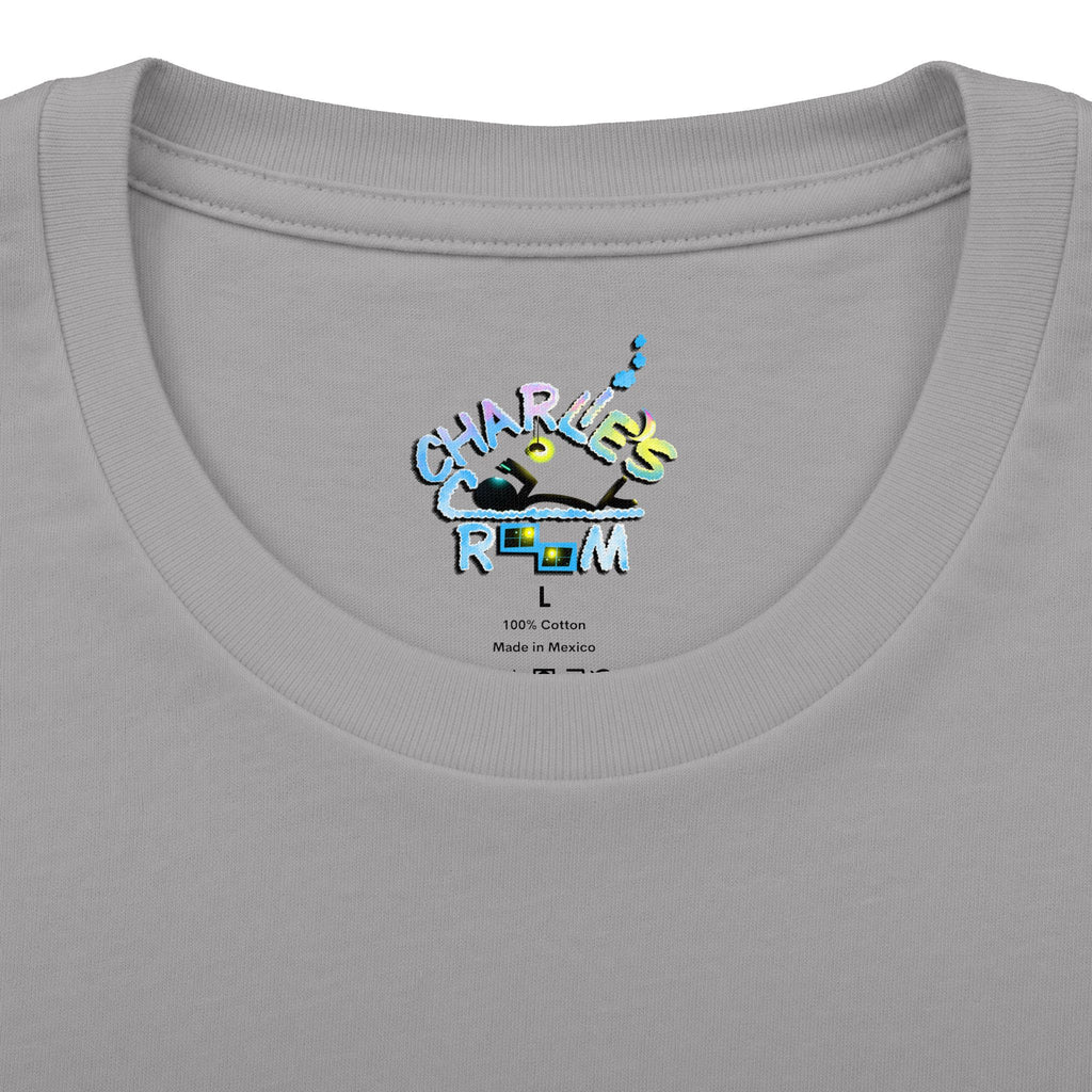 Close-up of a light gray crewneck t-shirt showing the inner neck label with a colorful graphic that reads 'CHARLIE'S COZY ROOM' and '100% Cotton Made in Mexico'.