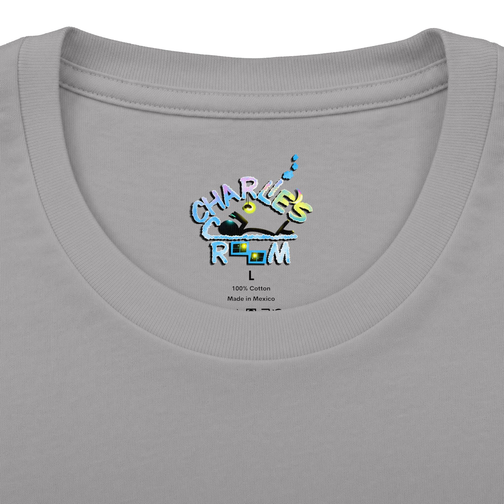 Close-up of a light gray crewneck t-shirt showing the inner neck label with a colorful graphic that reads 'CHARLIE'S COZY ROOM' and '100% Cotton Made in Mexico'.