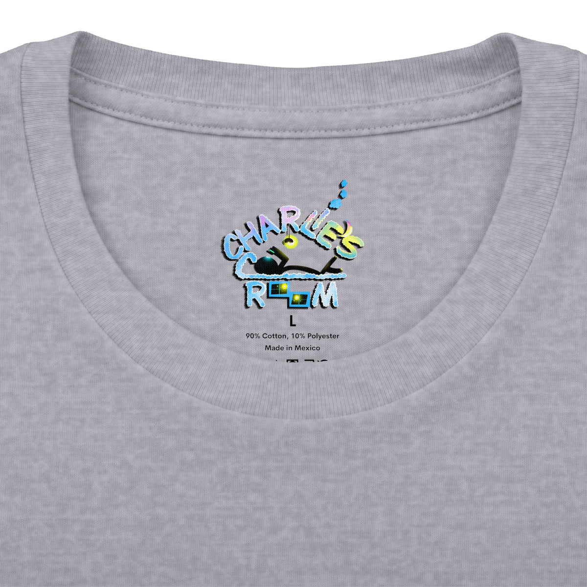 Close-up of a light heather gray t-shirt inner collar showing the Charlie's Cozy Room neck label logo, size L, and care details.