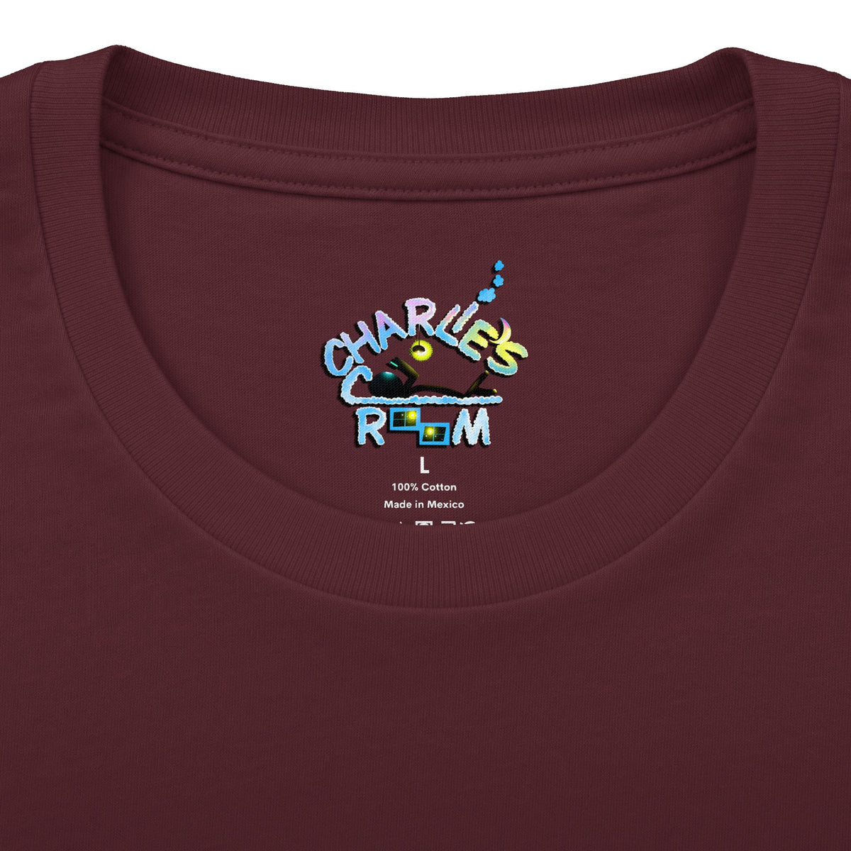 Close-up of a maroon crewneck t-shirt showing the inner neck label with the Charlie's Cozy Room brand logo, size L, and care details.