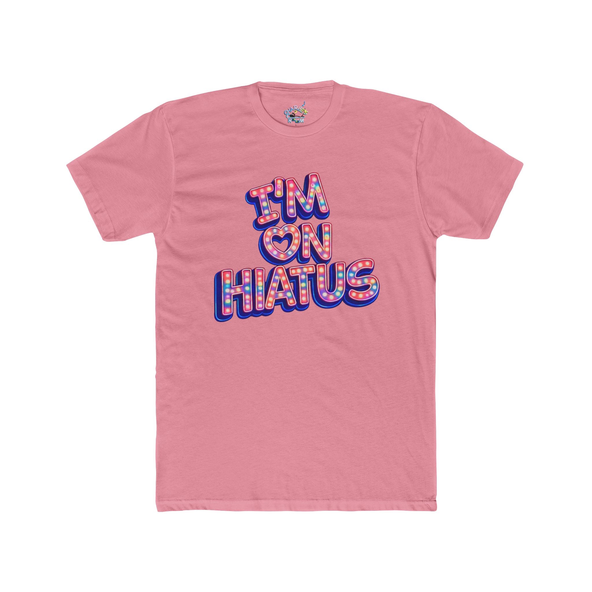 A pink short-sleeve crewneck t-shirt featuring a graphic on the front that reads 'I'M ON HIATUS' in a bubbly, colorful font with a red, white, pink, and blue patterned fill and blue shadow.