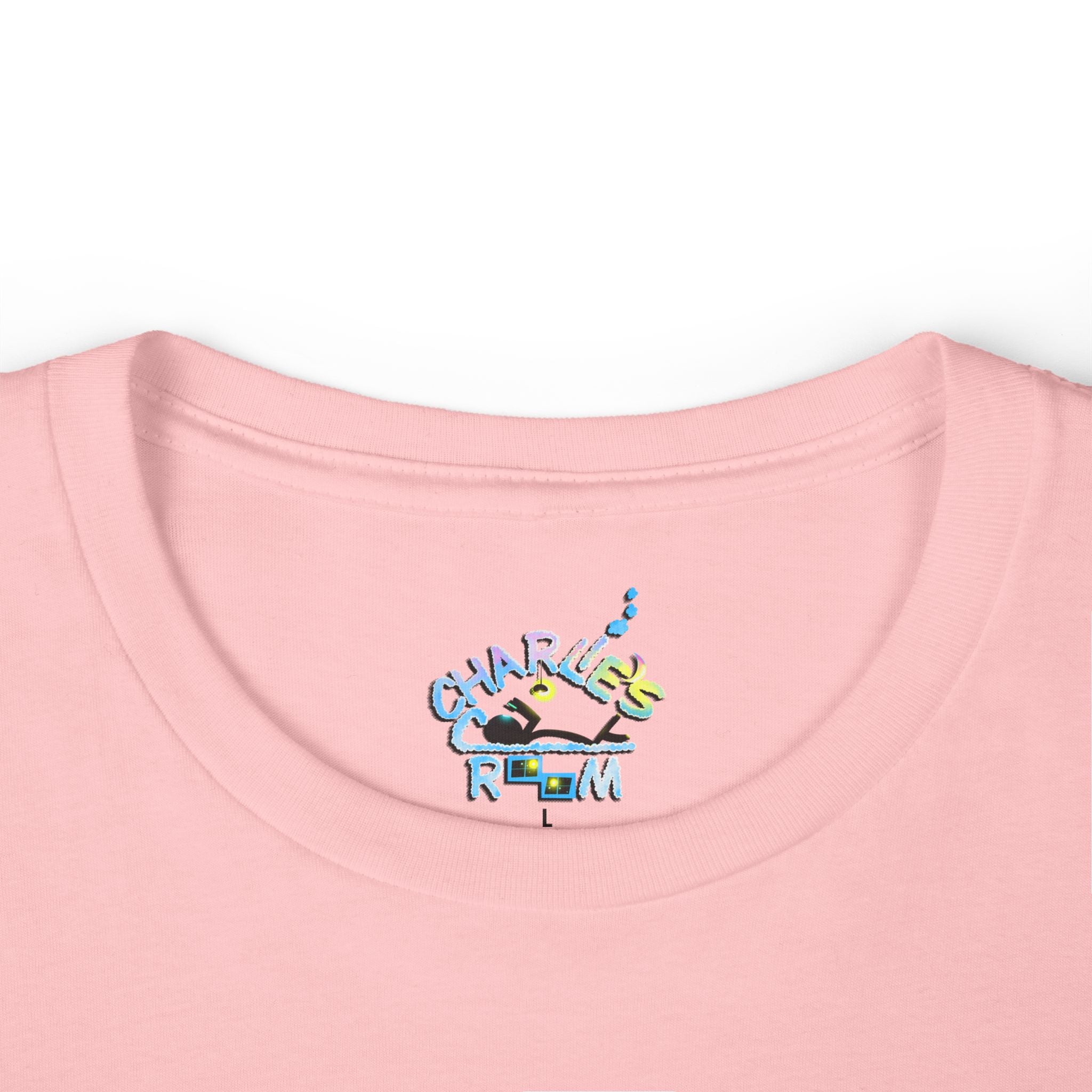 Close-up of a light pink crewneck t-shirt featuring the custom "Charlie's Cozy Room" logo inside-collar neck label graphic.