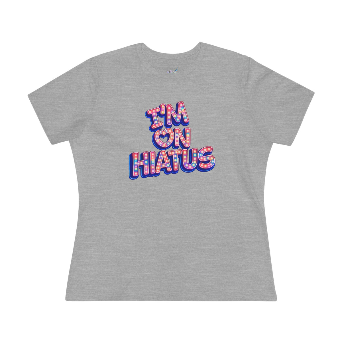 A heather gray short-sleeve t-shirt with a graphic on the chest that reads 'I'M ON HIATUS' in a retro bubble font filled with a red, white, pink, and blue pattern.