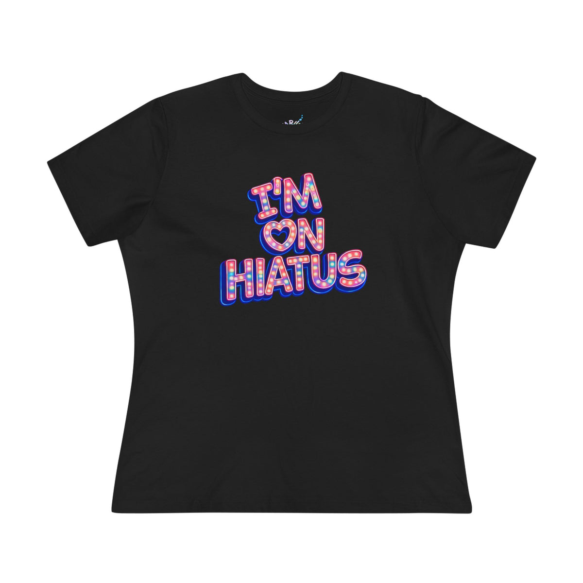 A black short-sleeve crewneck t-shirt with a colorful graphic on the chest that reads 'I'M ON HIATUS' in a retro bubble font with a red, white, and blue patterned fill.